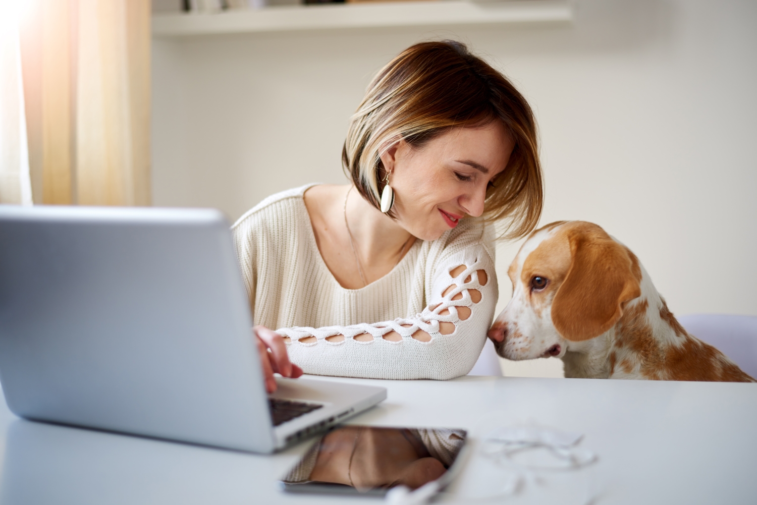 This is image of a brilliant and cheerful business professional, with her dog